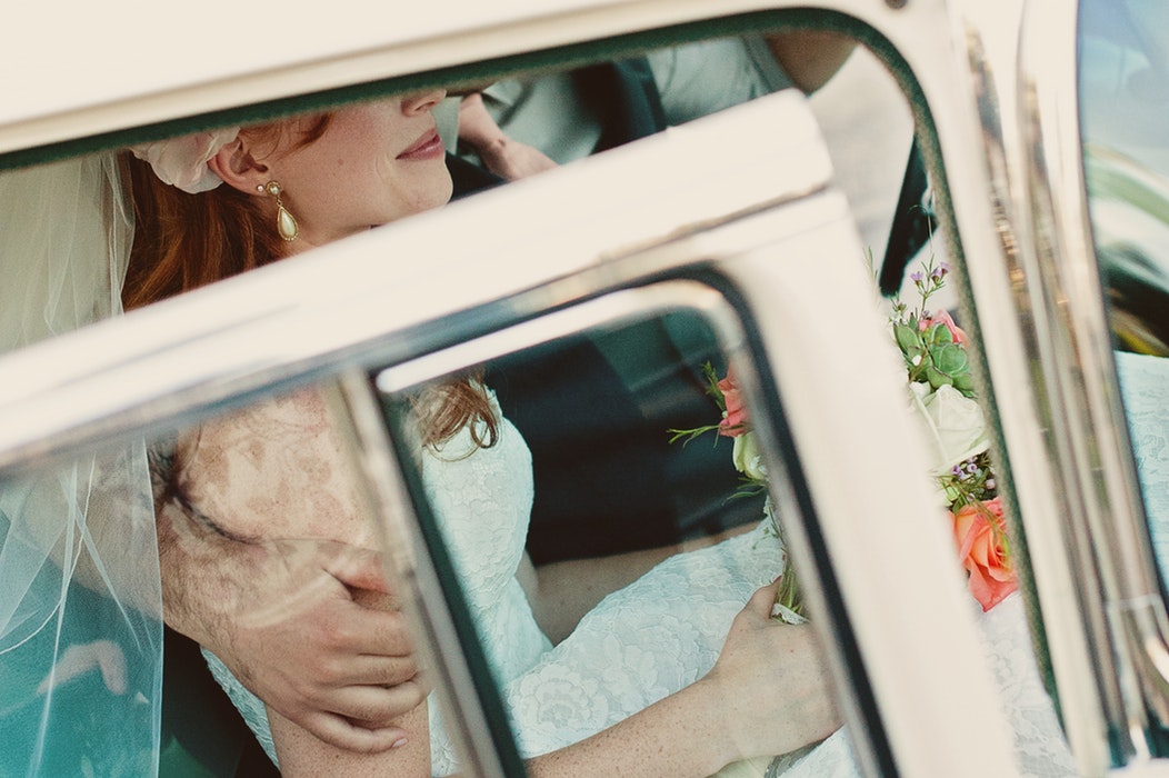 Bride in car.