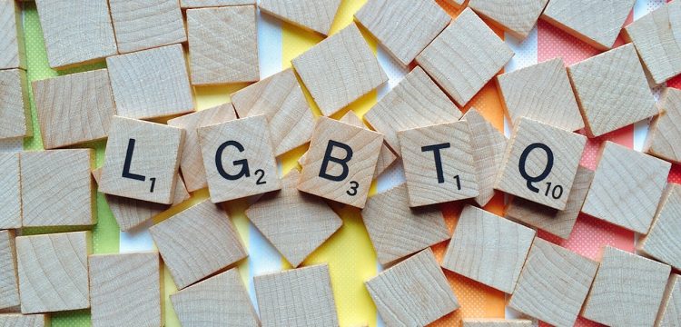Scrabble letters spelling out LGBTQ.