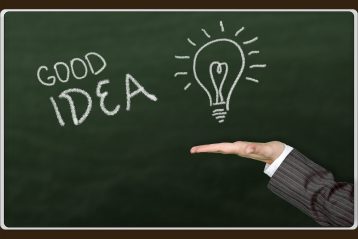 The words, "Good Idea" written on a chalkboard with a drawing of a lightbulb.