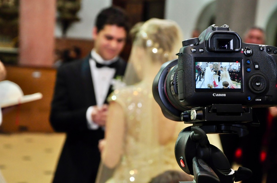 Bridal couple being filmed.