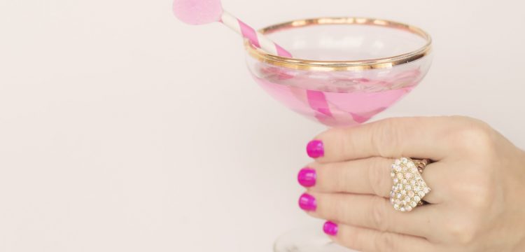 Woman holding a champagne glass.