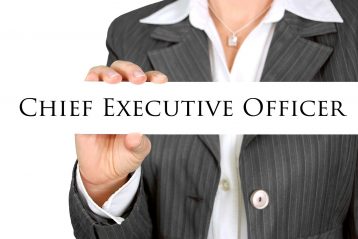 Person holding a sign that reads, "Chief Executive Officer".