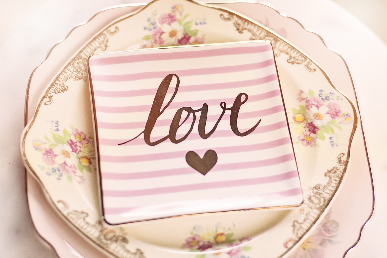 A dessert plate with the word "Love" on it.