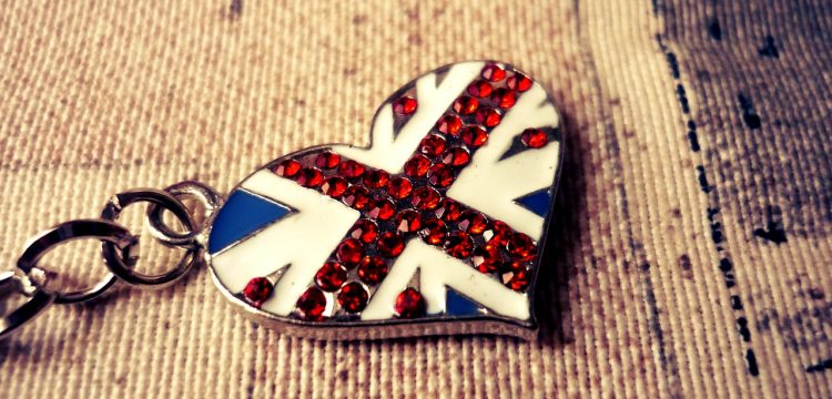 A keychain in the shape of a heart, featuring the British flag.