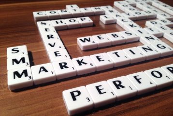 Scrabble letters spelling out words such as marketing, shop, website, etc.