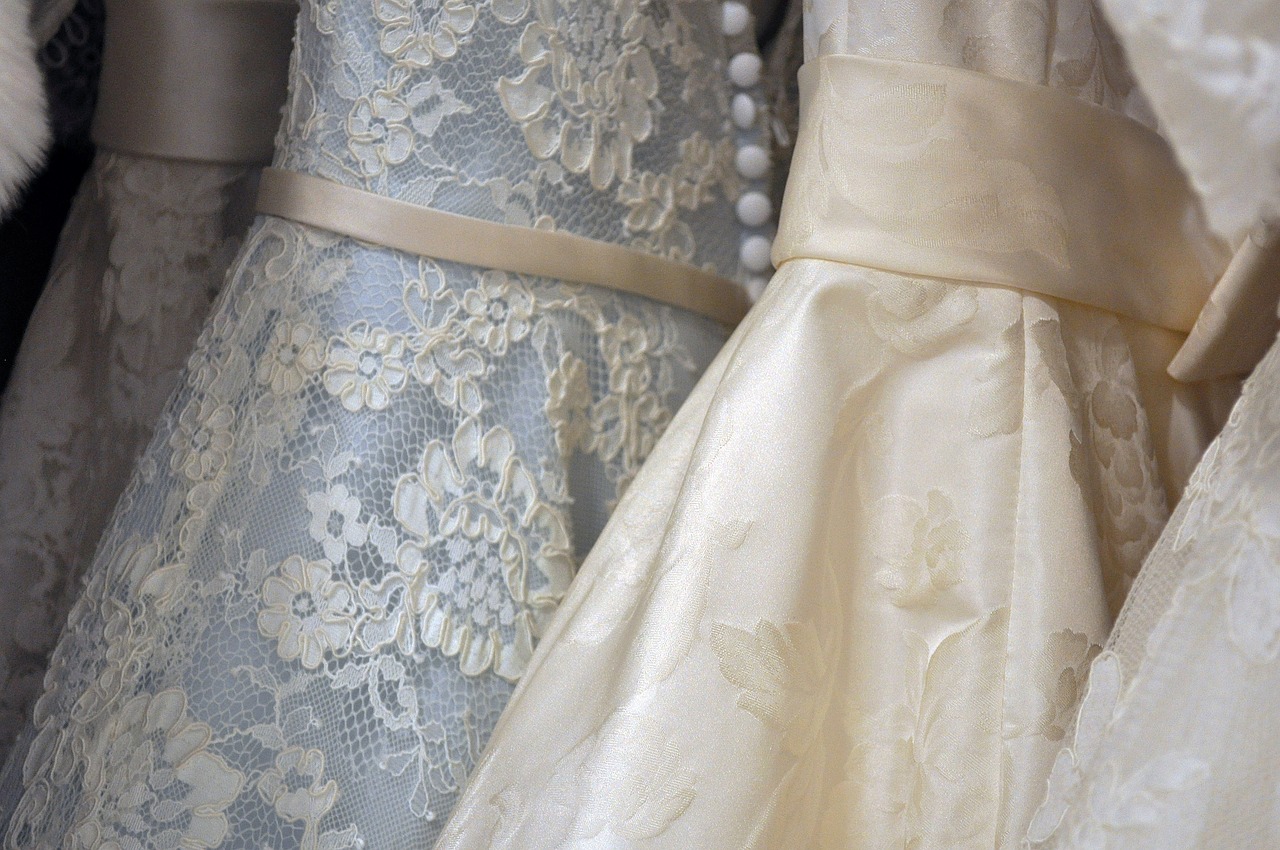 A row of hanging wedding gowns