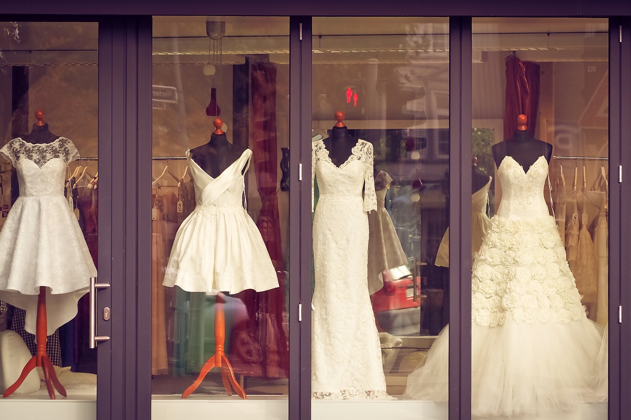 Wedding dresses in the window of a gown shop.