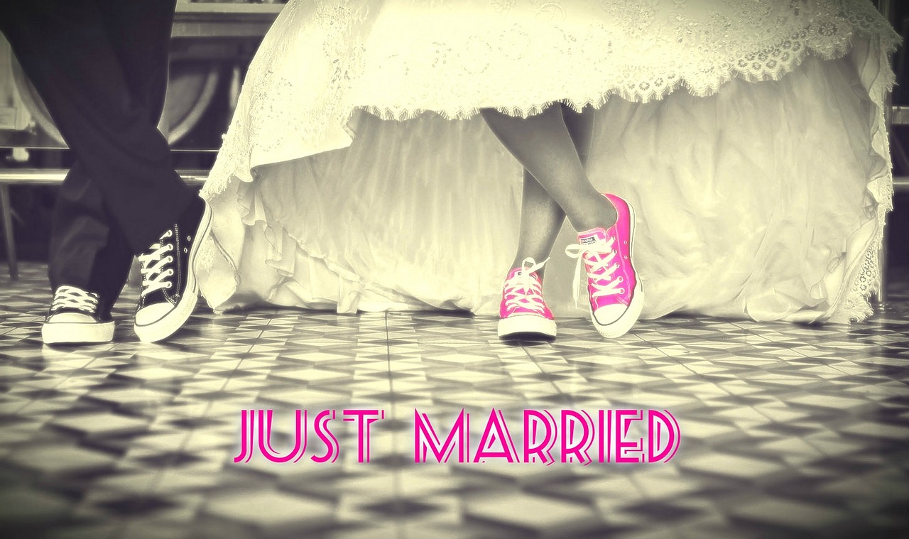Picture of bride and groom wearing sneakers.