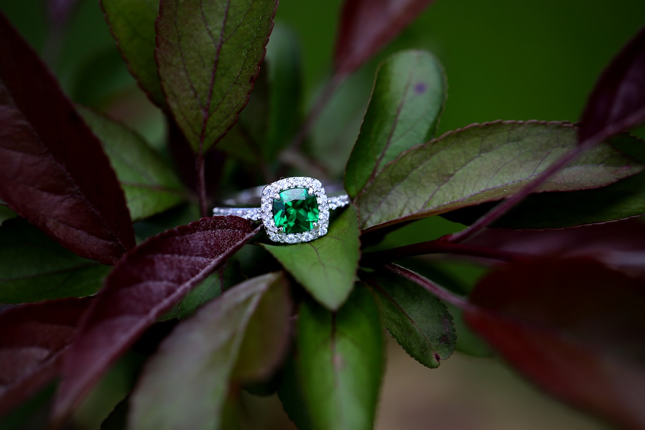 Engagement ring with a green stone.