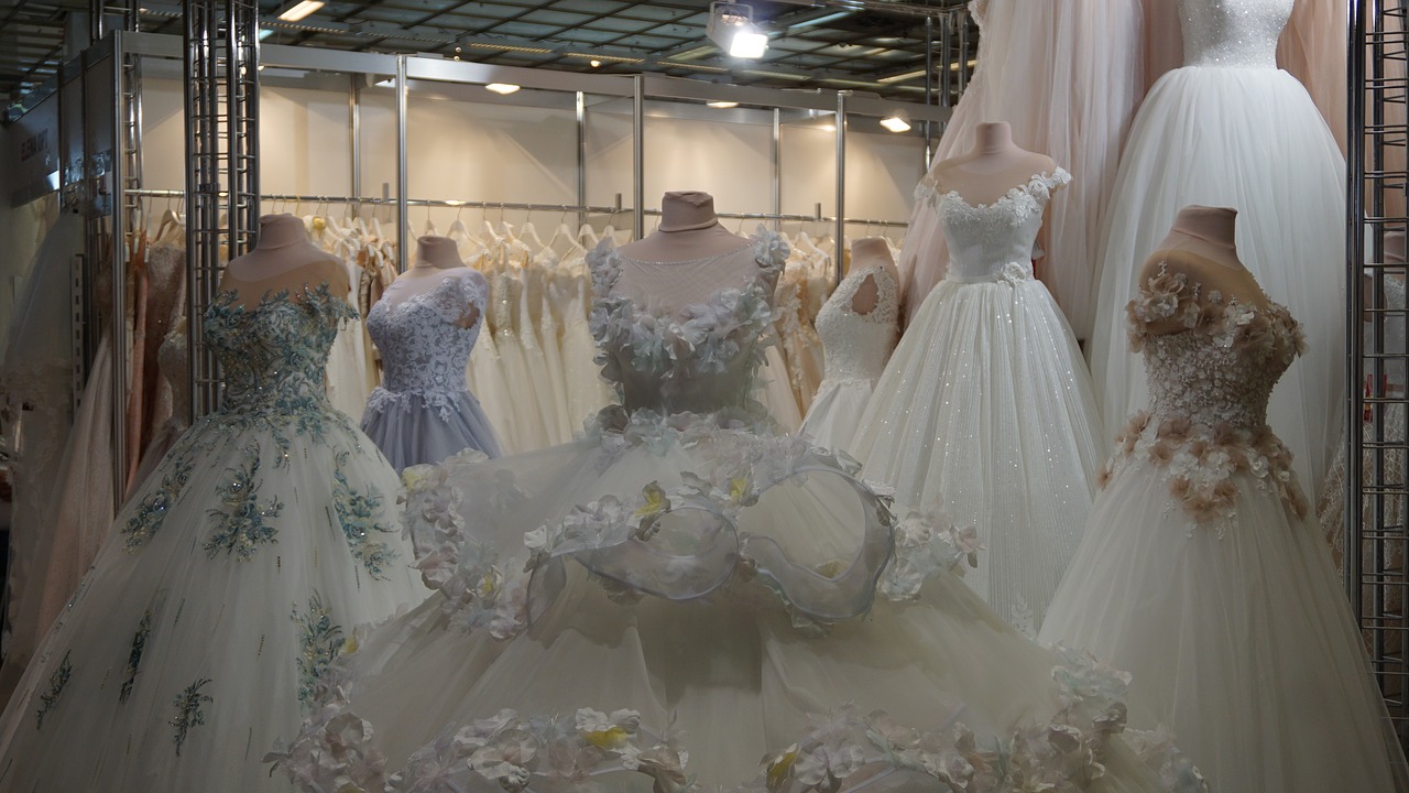 Wedding dresses on display on mannequins.