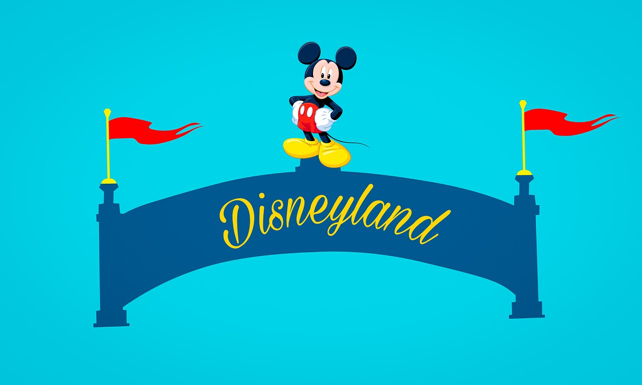 Mickey Mouse atop a banner that reads, "Disneyland".