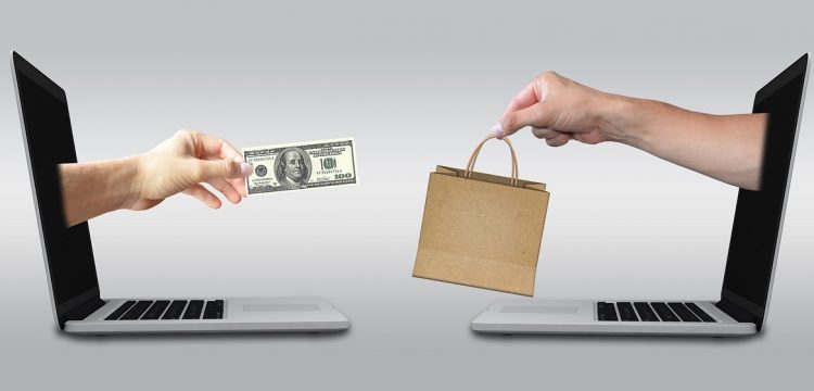 Graphic of one hand with a dollar bill and one hand with a shopping bag, reaching toward one another.