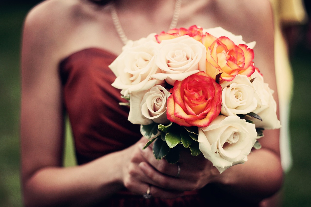 Bridesmaid holding a bouquet.