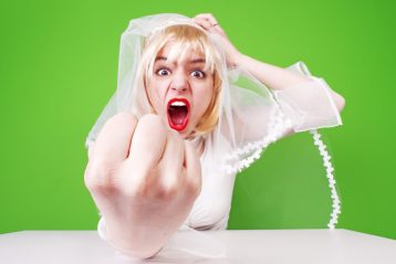 Angry bride clenching her fist.