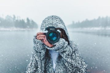 Photographer taking pictures in a beautiful winter scene.