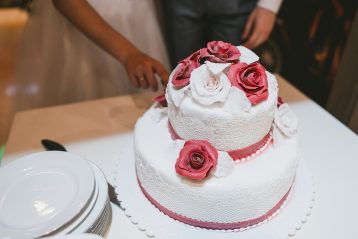 Wedding cake with red rose icing.