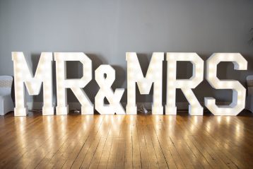 Big lighted letters that spell out Mr. & Mrs.