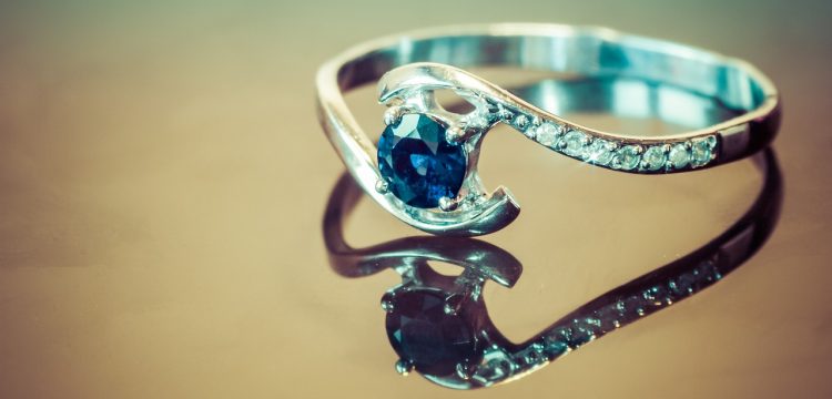 A diamond and sapphire engagement ring.
