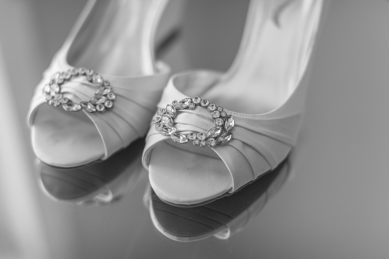 White wedding heels with jewels on them.