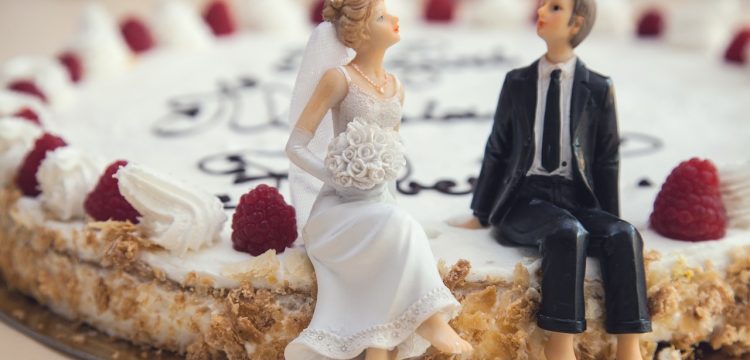 Bride and groom figurines on a non-traditional wedding cake.