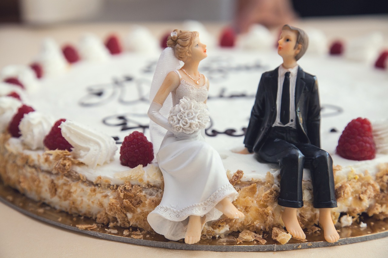 Bride and groom figurines on a non-traditional wedding cake.
