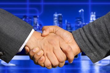 A handshake signifying a merger.