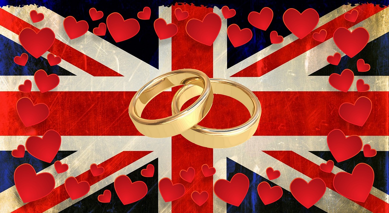 Wedding bands surrounded by hearts on a flag of Great Britain.