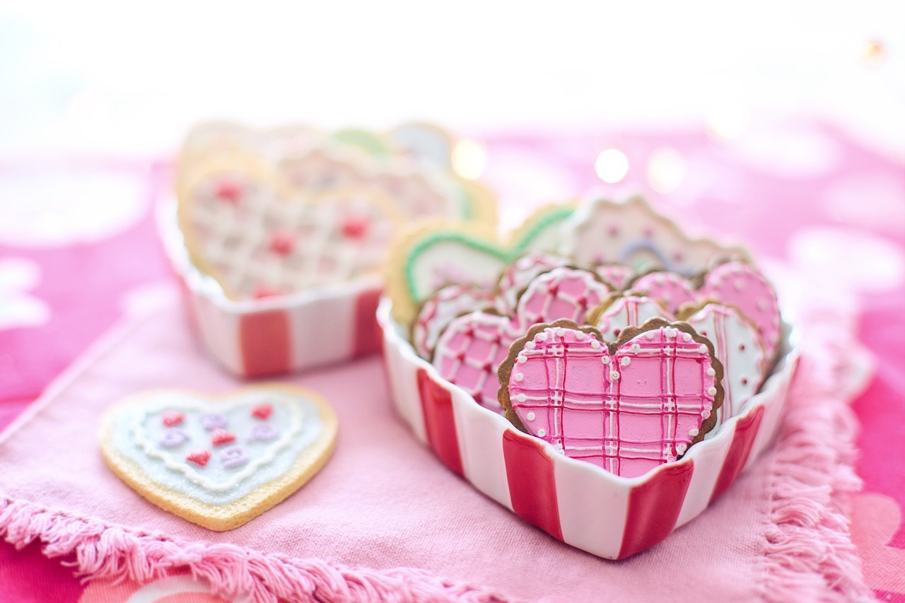 A table of wedding cookies, shaped like hearts.