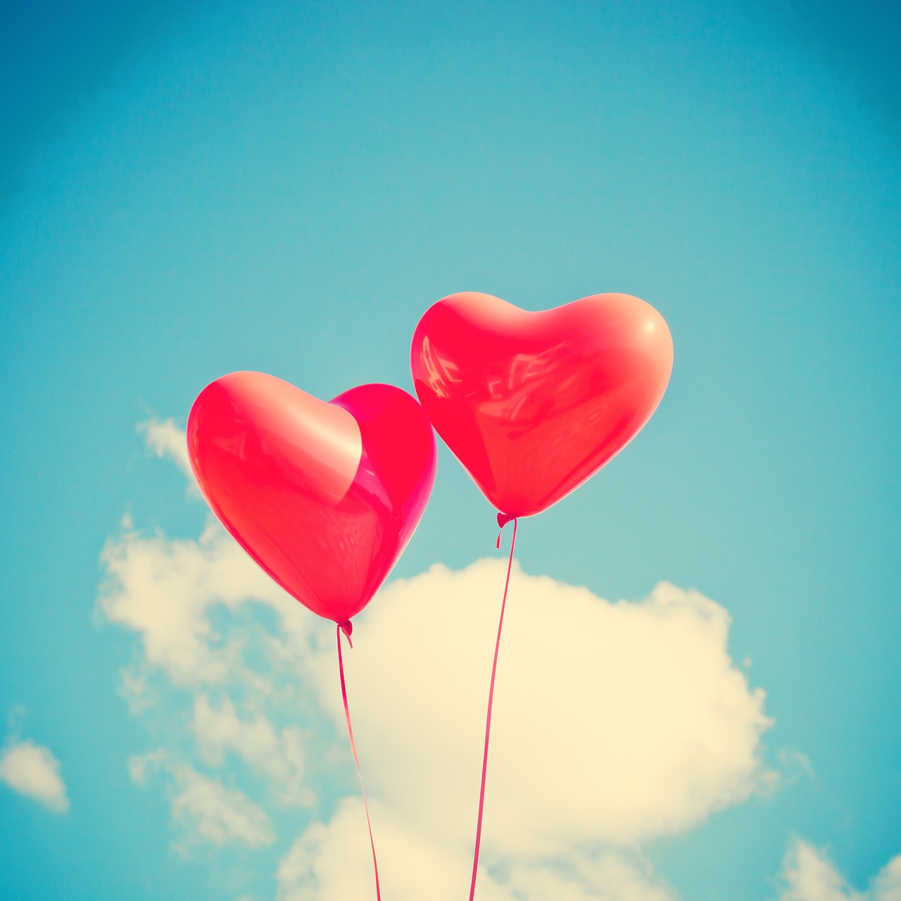 Two heart-shaped balloons.