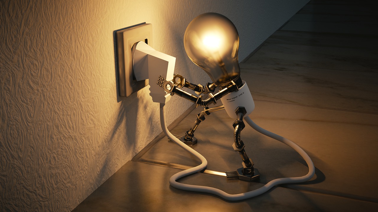 A light bulb inserting a plug to denote power.
