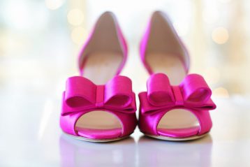 Bright pink bridal shoes.
