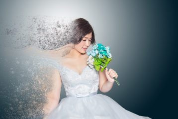 Model wearing a high fashion wedding dress.