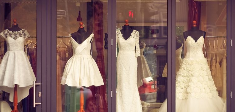 Wedding gowns in storefront.