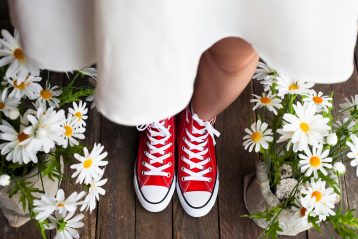 Bride wearing red sneakers.