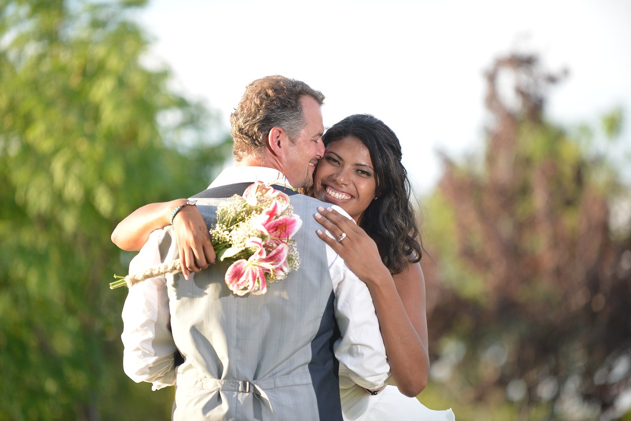 Bride and groom hugging.