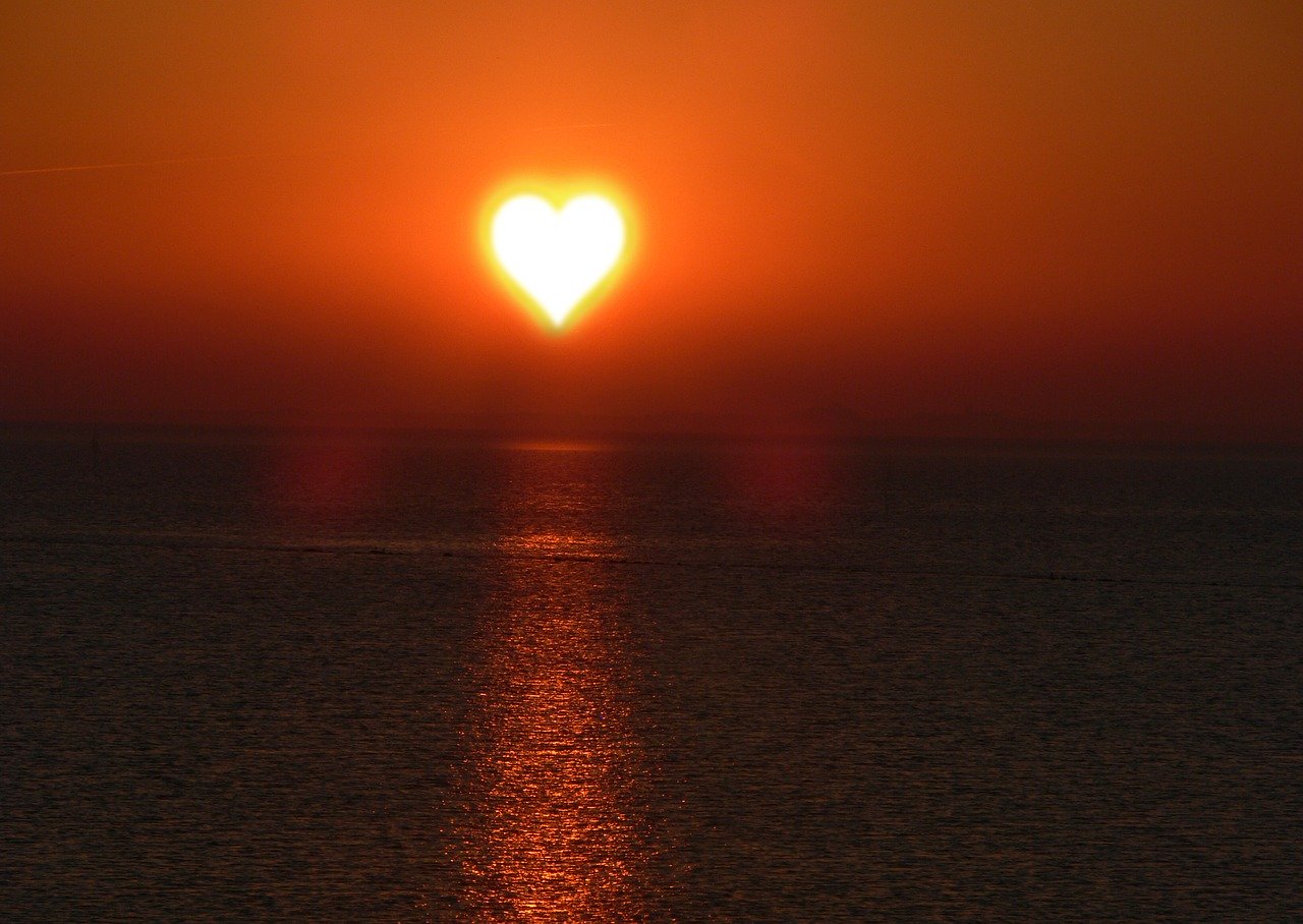 The sun in the shape of a heart.