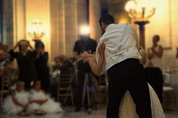 Bride and groom dancing.
