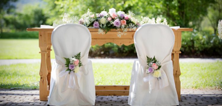 Wedding reception chairs at a table.