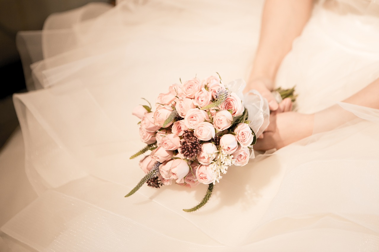 Bride holding flowers.