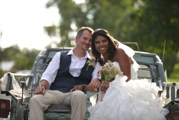 Bride and groom smiling.