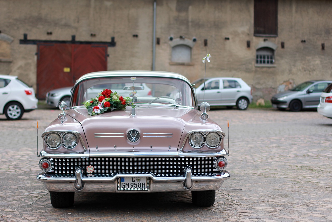 50s car with a bride's bouquet resting on top.