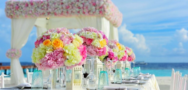 A fancy reception table for a beach wedding.