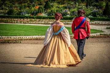 A prince and princess walking.