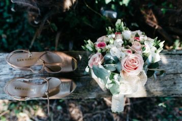 Bride's shoes and bouquet.