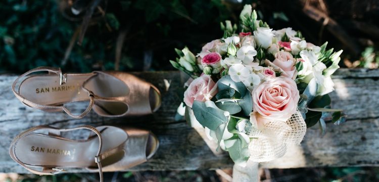 Bride's shoes and bouquet.