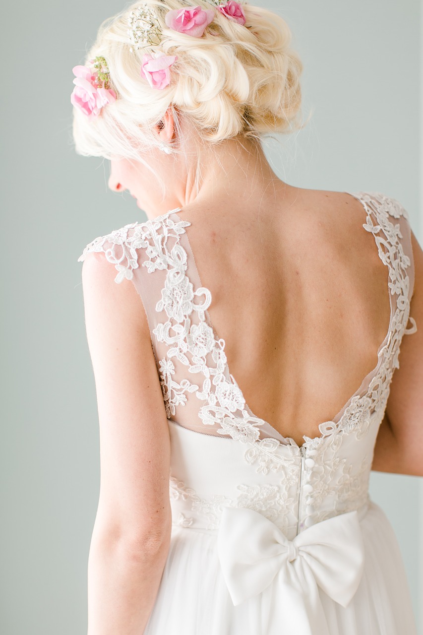 Blonde bride with back to camera.
