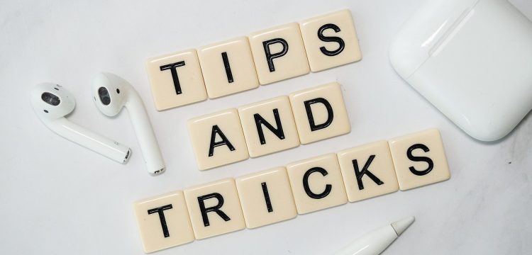 Scrabble pieces that spell out "Tips and Tricks".