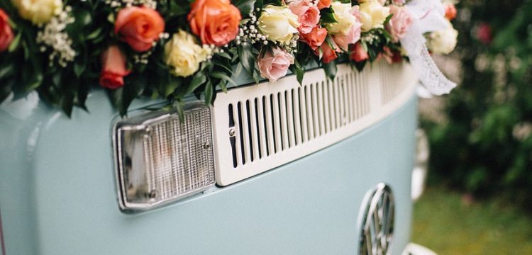 1970s era van with wedding flowers on it.