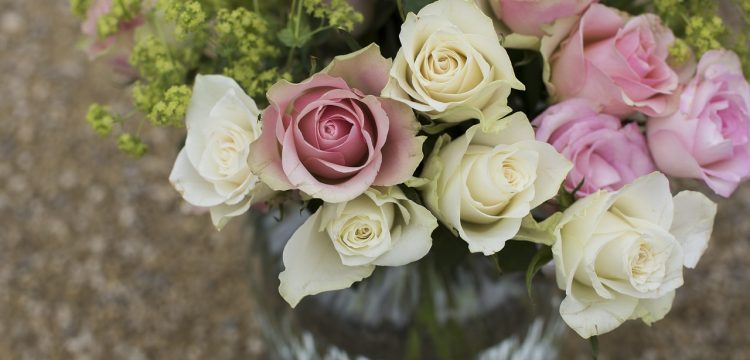 Bouquet of pink and white roses in a vase.