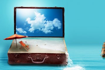 A suitcase with a beach pictured inside of it.